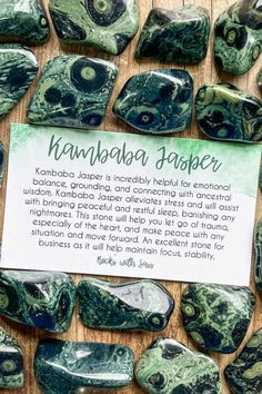 some green and white rocks with a sign on it that says nambaba dapper