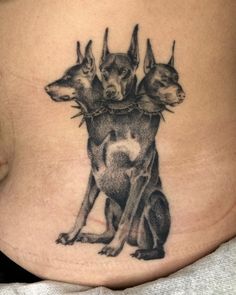 a woman's stomach with two dogs on it