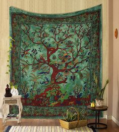 the tree of life tapestry is hanging on the wall