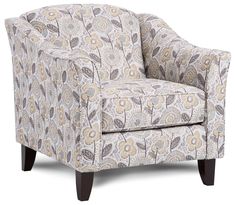 an upholstered chair with a flower pattern on the armrests and legs