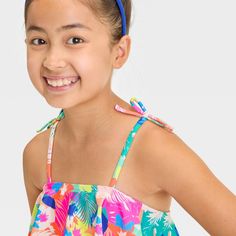 Add a standout piece to your kid's swim closet with the Mosaic Design Bikini Set from Cat & Jack™. This two-piece bikini set includes a sleeveless swim top with flounce and a pull-on swim bottom, both with mosaic print for a lovely look. Made from recycled polyester fabric with spandex and full lining, this classic-coverage bikini set offers comfort in and out of the water. Plus, the UPF 50+ rated design helps keep them shielded from the sun. Cat & Jack™: Designed for all children so you can tru Playful Pink Adjustable Swimwear, Cute Swimwear With Uv Protection For Vacation, Summer Swimming Tops With Uv Protection, Cute Swimwear With Uv Protection For Poolside, Cute Swimwear For Summer Vacation, Cute Summer Swimwear For Vacation, Cute Spring Vacation Swimwear, Spring Beachwear Swimwear For Play, Cute Summer Vacation Swimwear