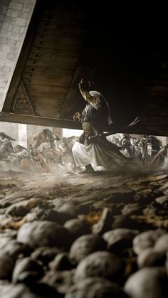 an image of a man in costume walking through a room full of skulls and bones