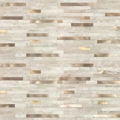 a white and gold tile wall with metallic strips on it