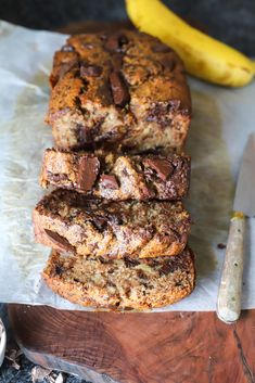 chocolate chip banana bread sliced on top of a cutting board