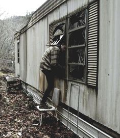 a person standing on the side of a train