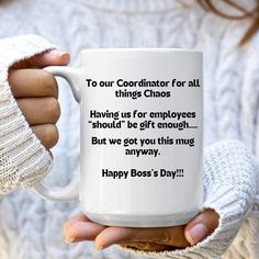 a woman holding a coffee mug with the words happy boss's day on it