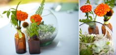 two vases filled with flowers and plants on top of a table