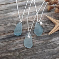 W E A R  *  T H E  *  E N E R G Y  *  O F  *  T H E  *  S E A The jewelry that carries the energy of the sea!  Dazzling sterling silver curb chain necklace accompanied  by beautiful seafoam blue authentic sea glass pendant attached on the small silver ring. From the drop down menu select one of the three styles displayed on the second photo (sea glass only, sea glass with a tiny cubic zirconia charm, sea glass with a pearl charm).  Delicate and elegant look for everyday wear. Perfect to treat yo Photo Sea, Seaglass Jewelry, Seafoam Blue, Necklace Elegant, Sea Glass Pendant, Necklace Display, Sea Glass Necklace, Everyday Necklace, Minimal Jewelry