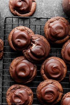 chocolate cookies with frosting on a cooling rack