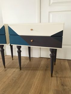 two blue and white drawers sitting next to each other on top of a wooden floor