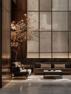 a living room filled with furniture and a tall vase on top of a coffee table