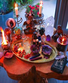 a table with candles, rocks and other items on it