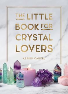 the little book for crystal lovers by astridd cavel with candles and crystals