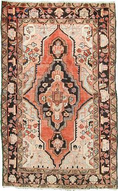 an old rug with many different colors and patterns