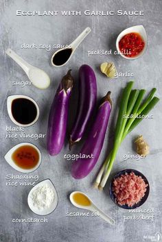 ingredients for eggplant with garlic sauce laid out on a gray surface and labeled