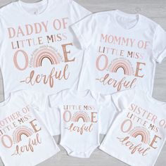 three matching shirts with the words daddy of little miss, mommy of onederful and rainbow