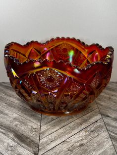 a glass bowl sitting on top of a wooden table