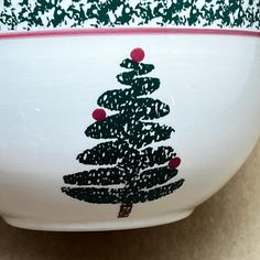 a bowl with a christmas tree painted on it