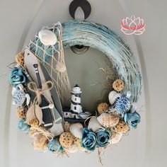 a wreath with shells, seashells and other items