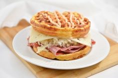 a waffle sandwich with ham and cheese on it