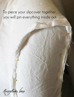 a piece of white fabric with the words to place your slipover together, you will pin everything inside out