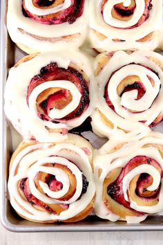 freshly baked pastries with white icing in a pan