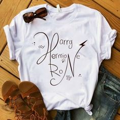 a t - shirt with the words harry potter on it next to shoes and sunglasses