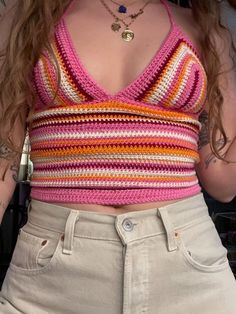 a close up of a person wearing shorts and a tank top with crochet