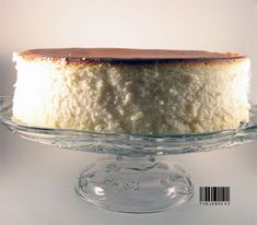 a white cake on a glass platter