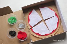 an open pizza box with some cut up pieces