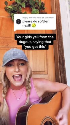 a woman holding an acoustic guitar in front of a door with the caption'your girls tell from the dugout, saying that you got this