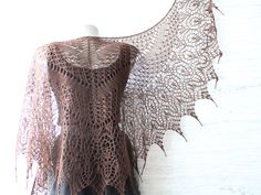 "A hand knit wool Victorian shawl is a cozy and warm accessory that's perfect for chilly autumn and winter days.  This lace stole made from soft merino wool in deep brown color with golden beads  on the ends has features intricate patterns and designs.  Lightweight warm shoulder wrap can be worn draped over your shoulders or wrapped around your neck like a triangle scarf.  It's perfect for adding a touch of vintage charm to your outfit, and for keeping you warm on cold days. * Merino wool shawl has 140 cm (55,11\") wide and has 65 cm (25,6\") in the center point. Beaded shawl is a delicate and feminine accessory that adds a touch of romance to any outfit, perfect for wearing with a sleeveless or strapless dress, or for adding a touch of elegance to a casual outfit. Victorian shawl  can be Black Lace Shawl Weddings, Gothic Shawl, Witchy Shawl, Goth Crochet Shawl, Victorian Shawl, Bohemian Brown Shawl, Brown Shawl, Great Anniversary Gifts, Triangle Scarf