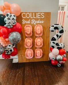 balloons and decorations are on the floor in front of a sign that says collies and rodeo