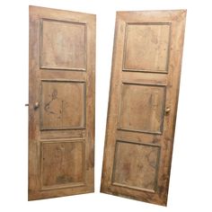 two old wooden doors are open on a white background