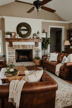 a living room with two couches and a fire place in the middle of it