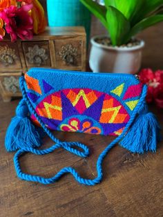 Colombian Crossbody Handmade Tapizada Wayuu Purse. Colorful - Etsy Colorful Bohemian Bags For Gifts, Colorful Bohemian Bags As Gifts, Colorful Bohemian Bags Perfect As Gifts, Handmade Multicolor Embroidered Shoulder Bag For Beach, Handmade Multicolor Embroidered Shoulder Bag For Vacation, Multicolor Tassel Pouch Bag, Blue Bohemian Crochet Bag With Woven Details, Handmade Blue Shoulder Bag For Festivals, Blue Bohemian Crochet Shoulder Bag