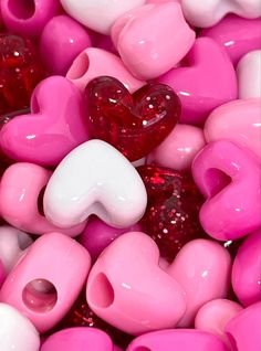 pink and white heart shaped beads are shown