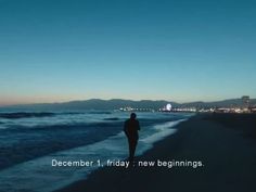 a person walking on the beach at night with city lights in the background and text saying, december 1 friday new beginnings