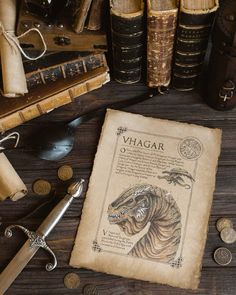 an old book is sitting on a table next to some books and other antique items