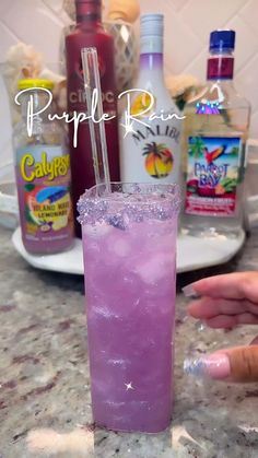 a purple drink sitting on top of a counter