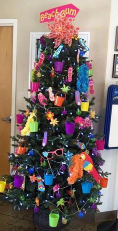 a decorated christmas tree in the corner of a room