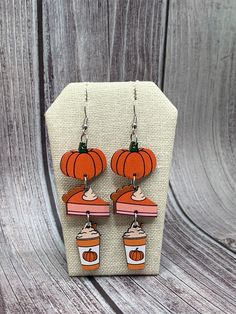 Fall pumpkin, pumpkin pie and pumpkin spice latte theme dangle earrings. Made with wood and stainless steel. Thanksgiving Pumpkin Pie Stud Earrings For Fall, Thanksgiving Pumpkin Pie Earrings, Pumpkin Spice Latte Earrings, Pumpkin Spice Latte, Etsy Earrings Dangle, Pumpkin Pie, Fall Pumpkins, Pumpkin Spice, Jewelry Gifts