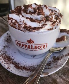 a cup of hot chocolate with whipped cream on top