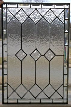 a large stained glass window sitting on top of a sidewalk