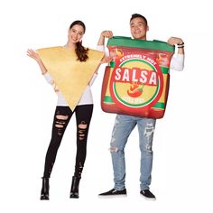 a man and woman holding up a bag of salsa