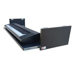 an electronic keyboard sitting on top of a metal shelf