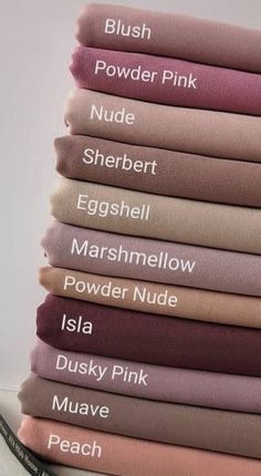 a stack of different colored sheets sitting on top of each other