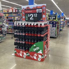 an empty soda display in a grocery store