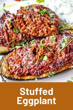 stuffed eggplant on a white plate with text overlay that reads stuffed eggplant