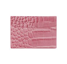 a pink alligator skin card case on a white background